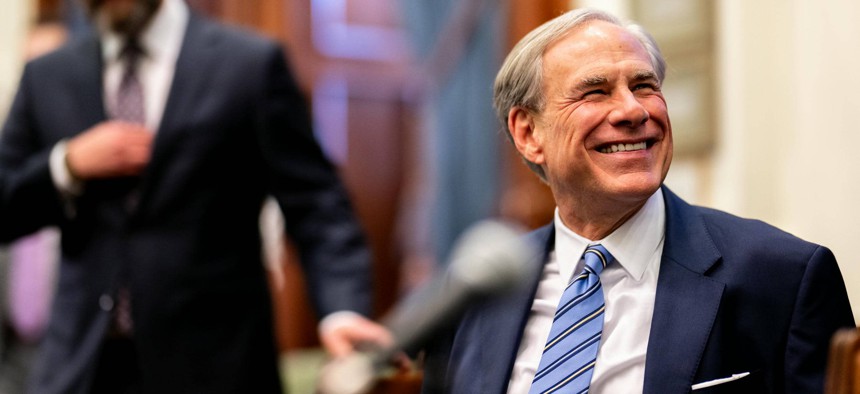 Texas Gov. Greg Abbott during a bill signing ceremony earlier this year. Abbott recently signed legislation creating the Texas Cyber Command.